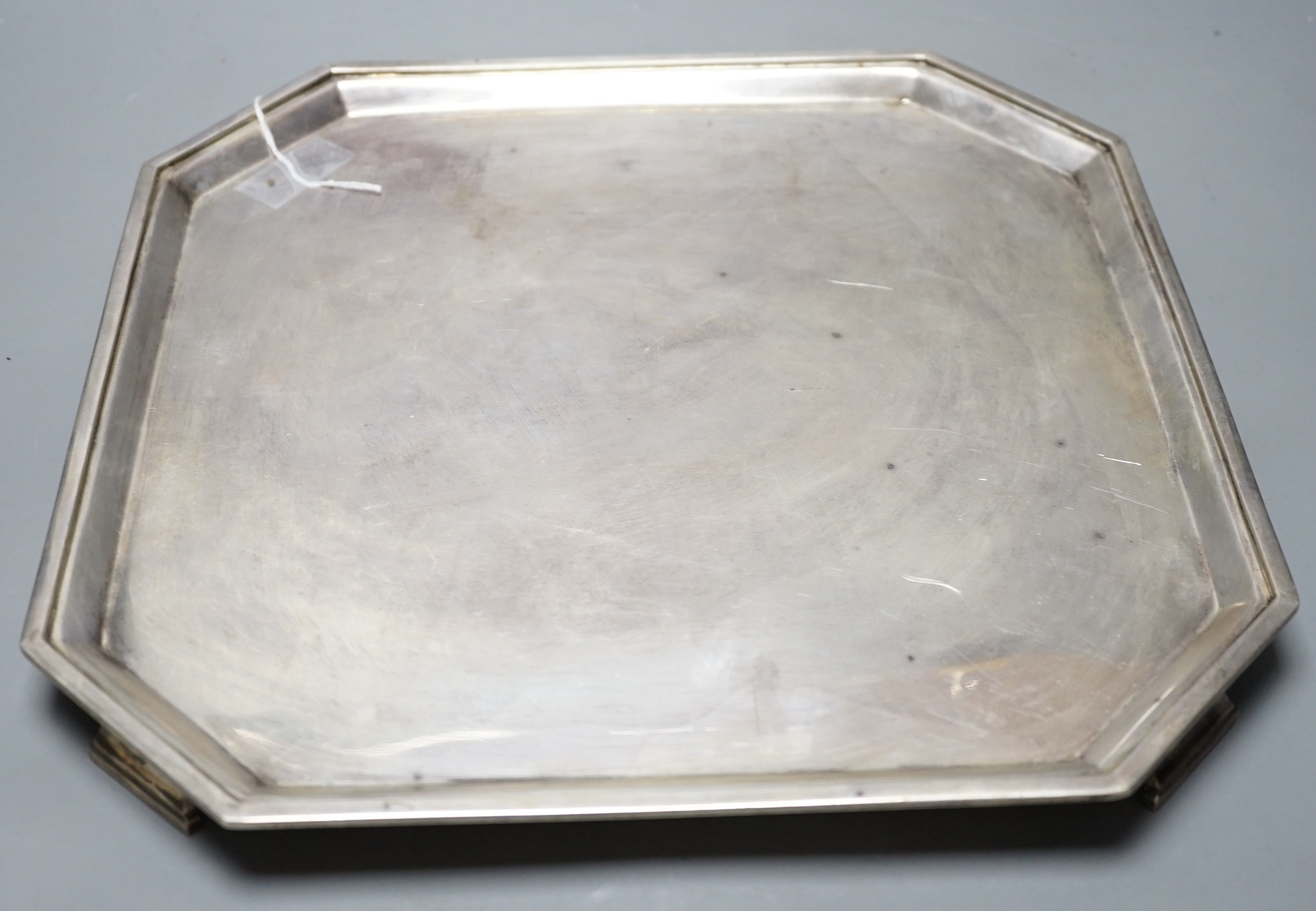 A George V silver square salver with canted corners, on straight feet, Thomas Bradbury & Sons, Sheffield, 1935, 31.1cm, 35oz.